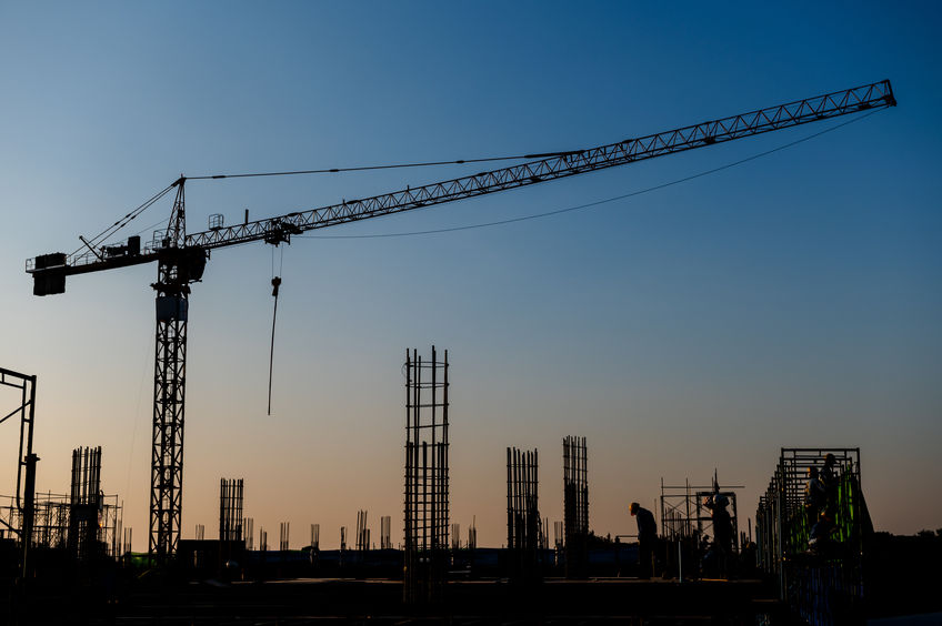 silhouette of industrial worksite at sunset